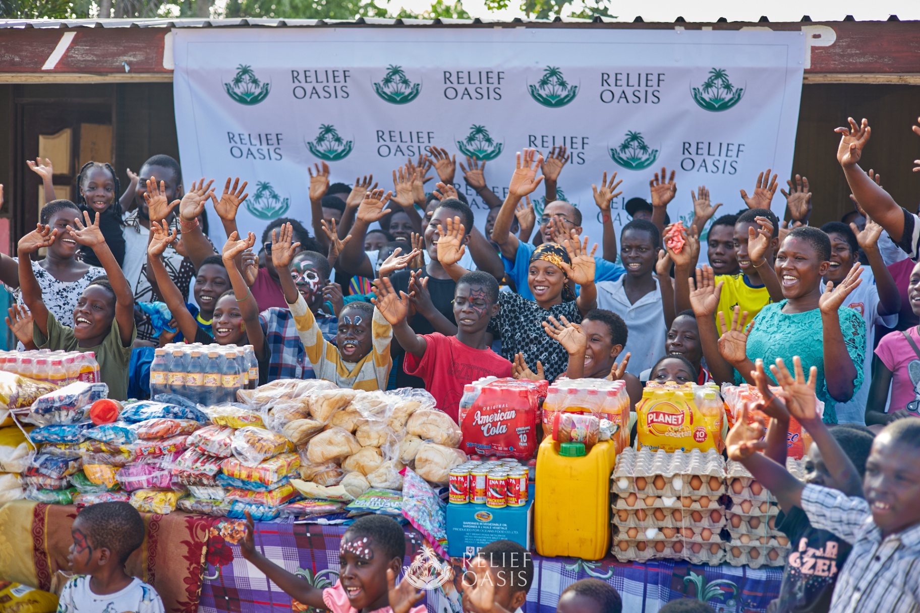 Children at Joy-Kol Orphanage in Ghana celebrating with supplies delivered by Relief Oasis.