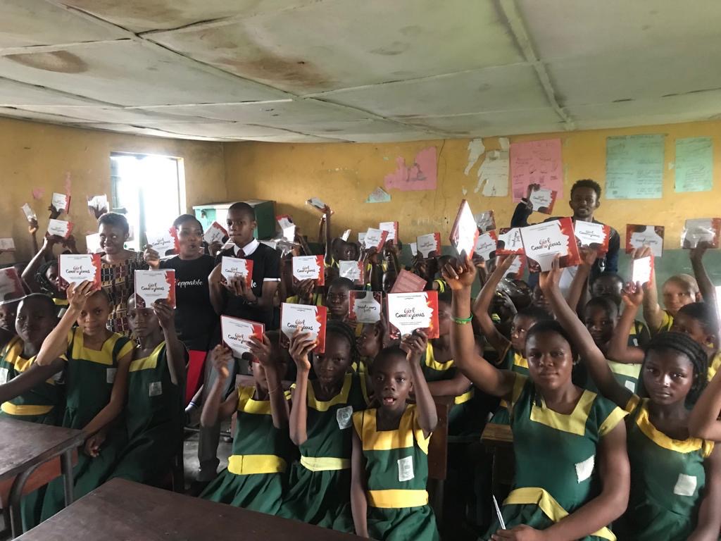 Girls engaged in a reading and book drive session in Ilaje community schools.