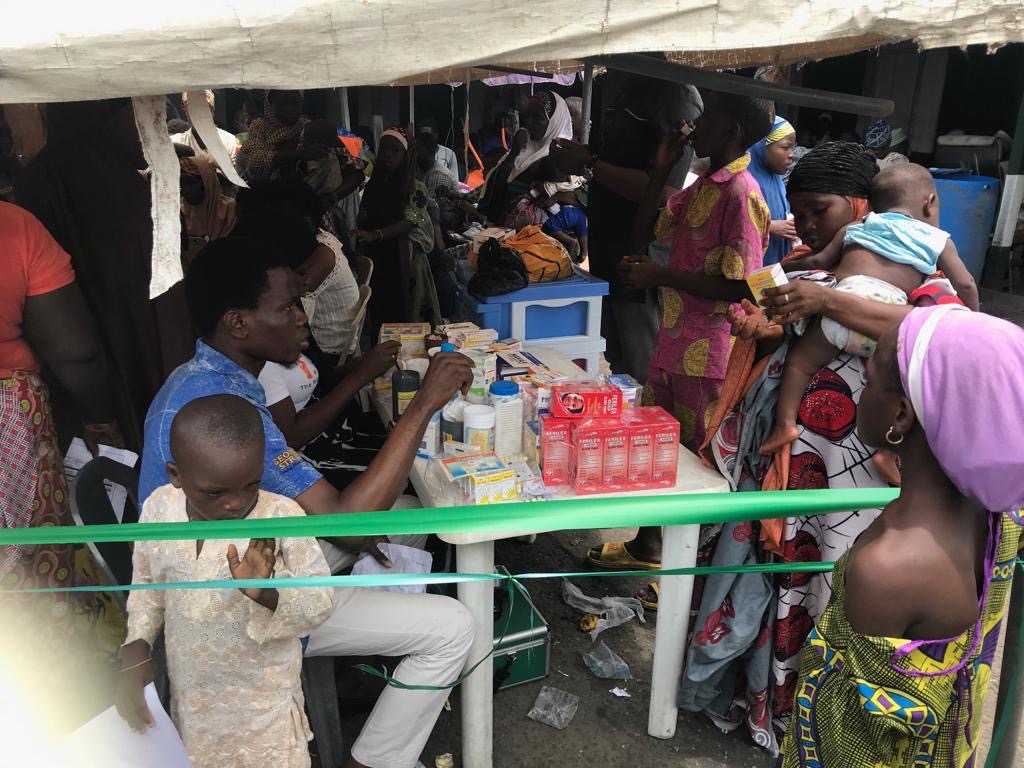 Health workers providing free medical care at the SEED-MEDGLOBE outreach at Okobaba.